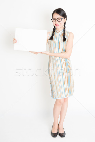 Asian female holding white blank paper card Stock photo © szefei