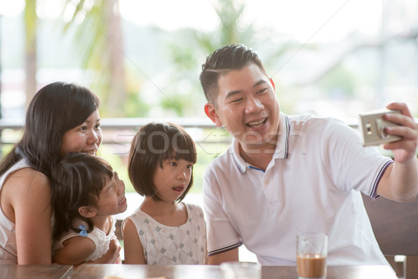 Family taking self photo Stock photo © szefei