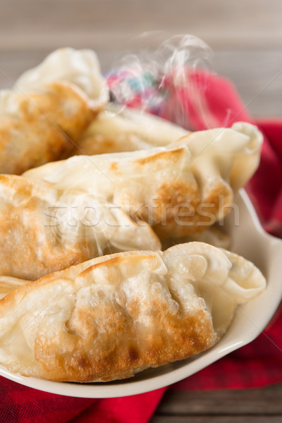 Pan fried dumplings Stock photo © szefei