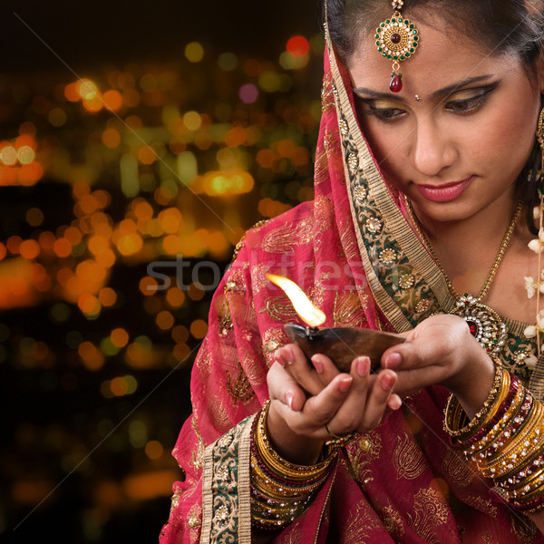Indian girl hands holding diwali oil lamp Stock photo © szefei