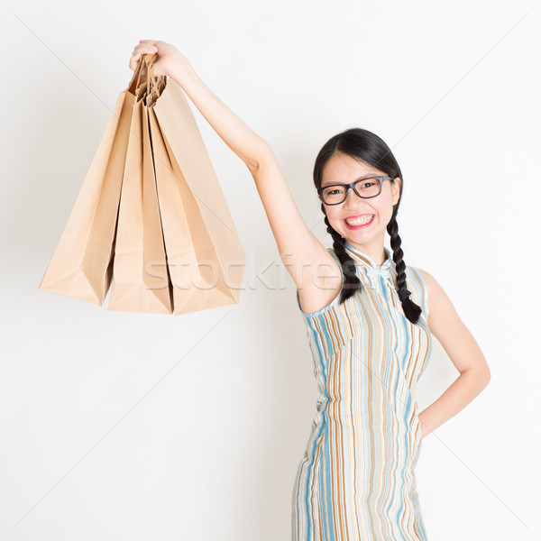 Oriental woman shopping Stock photo © szefei