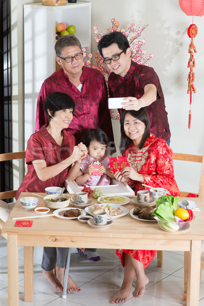 Selfie in Chinese New Year Reunion Dinner Stock photo © szefei