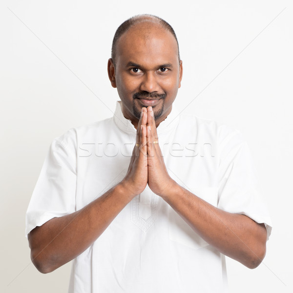 Mature casual business Indian man praying Stock photo © szefei