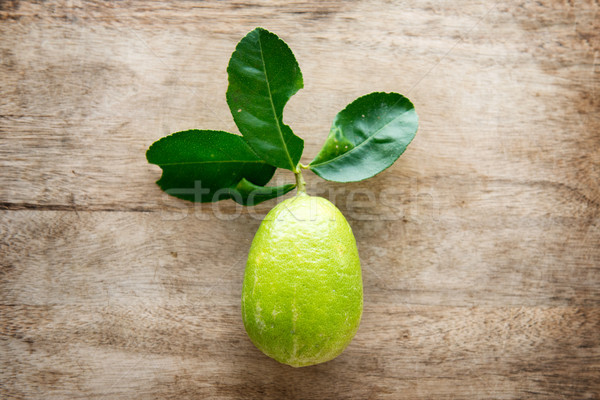 Fresh organic green lemon top view Stock photo © szefei