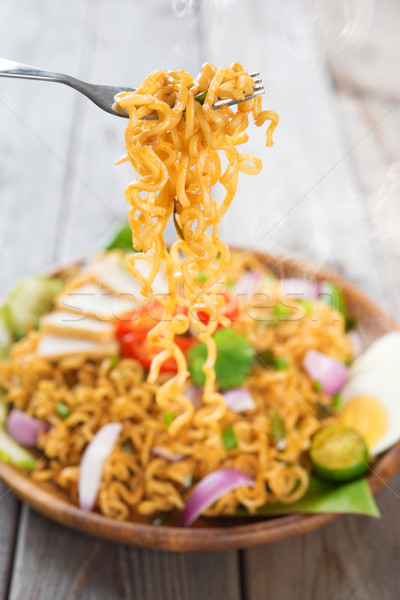 Spicy fried curry instant noodles Stock photo © szefei