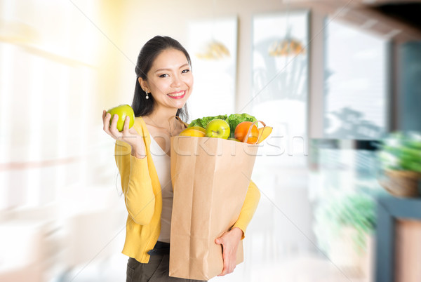 Woman holding groceries bag in market Stock photo © szefei