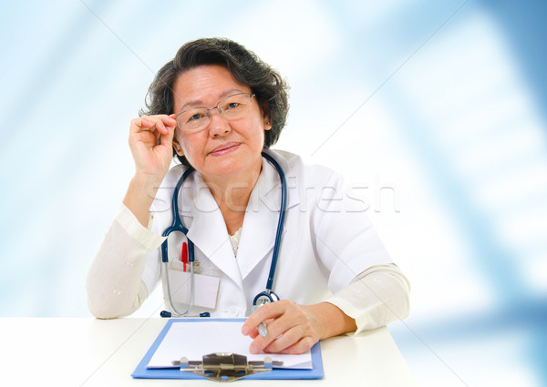 Asian senior female doctor Stock photo © szefei