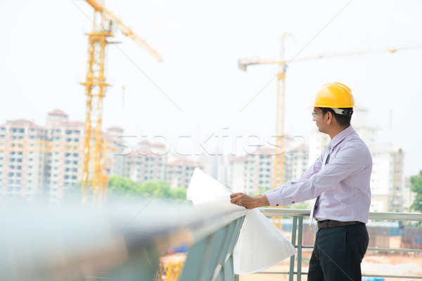 Asian Indian architect at construction site Stock photo © szefei