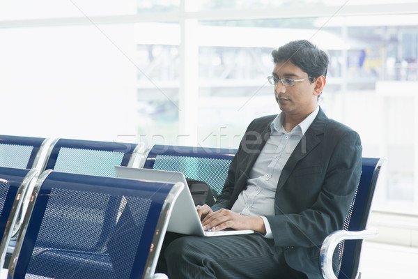 Indian business man at airport Stock photo © szefei