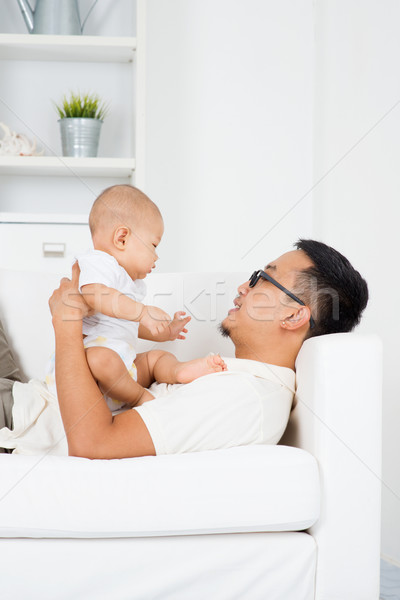 Father playing with baby  Stock photo © szefei