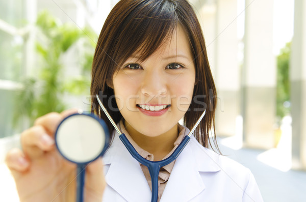 медик азиатских стетоскоп стороны девушки улыбка Сток-фото © szefei