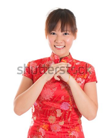 Chinese cheongsam woman greeting Stock photo © szefei