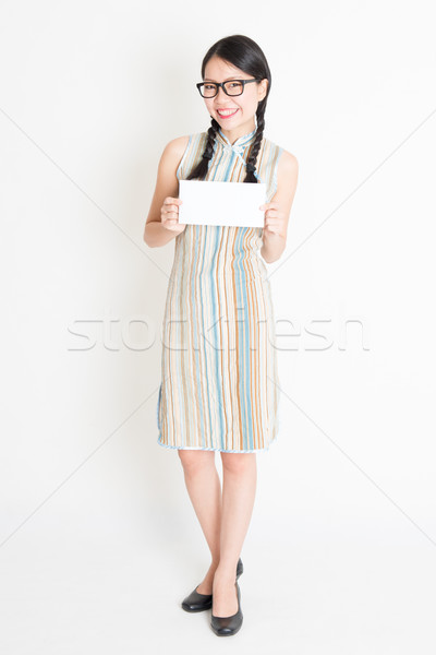 Asian woman holding white blank paper card Stock photo © szefei