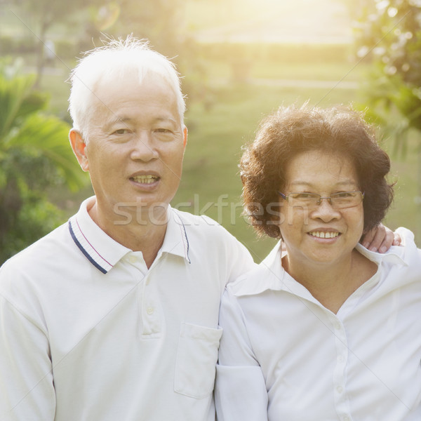 Happy Asian seniors couple Stock photo © szefei