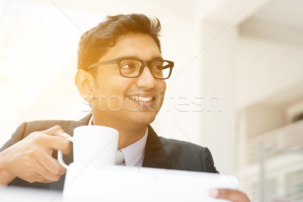 Business man using tablet pc at cafe Stock photo © szefei