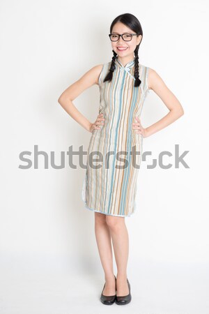 Asian girl greeting pose Stock photo © szefei