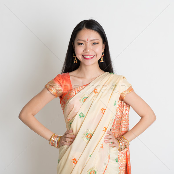 Stock photo: Confident Indian girl in sari smiling 