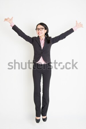 Asian businesswoman jumping Stock photo © szefei