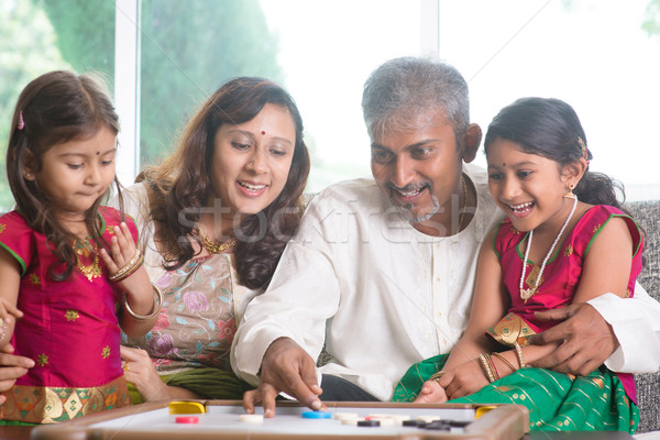 Indian family playing carrom game Stock photo © szefei