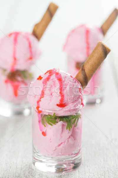 Strawberry ice cream in cups Stock photo © szefei