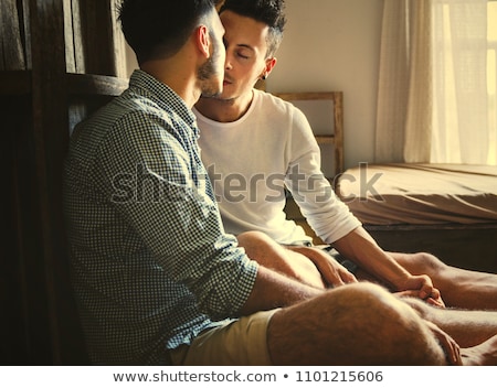 Foto stock: Affectionate Couple Kissing In Bed