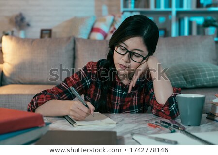 Foto d'archivio: Portrait Of The Young Girl With The Daily Log In Hands