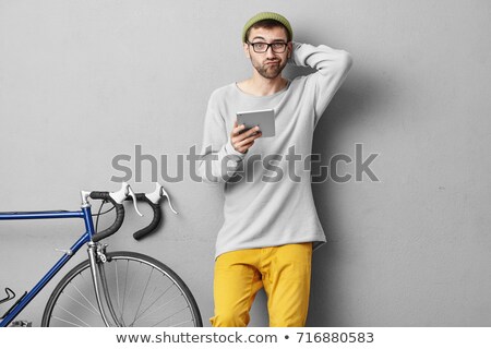 Сток-фото: Young Business Man With Tablet Scratches His Head