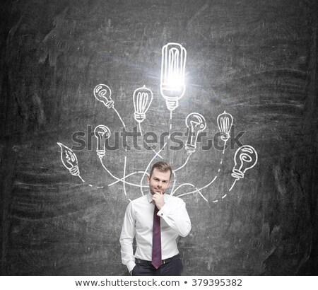 Stockfoto: Businessman With Lamp Head On Black Background Planning Future