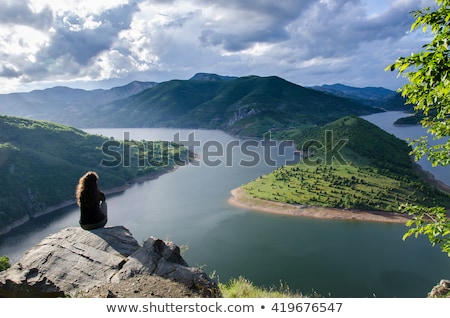 Stock photo: Young Beautiful Woman Meditate On The River