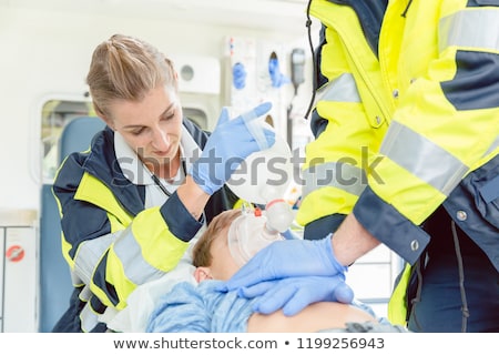 [[stock_photo]]: Paramedics Giving First Aid To Injured Person