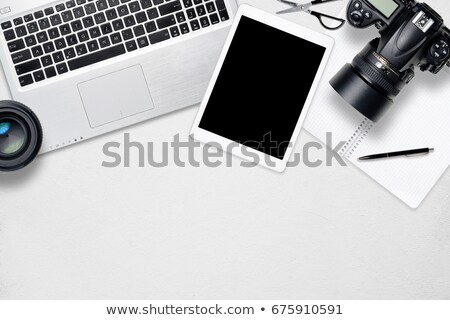 Foto stock: Office Desk With Camera Coffee And Notepad