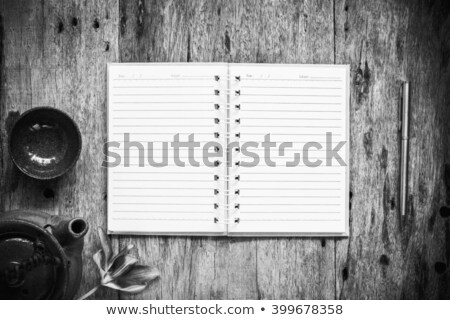 Foto stock: Open Notebook And Pen With Teapot On Old Wooden Background