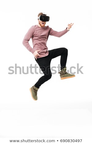 ストックフォト: Cheerful Bearded Young Man Wearing Virtual Reality Device