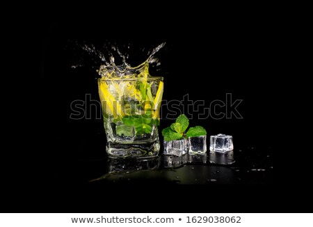 Stockfoto: Refreshing Mint Cocktail Mojito With Rum And Lime Cold Drink Or Beverage With Ice On Black Backgrou