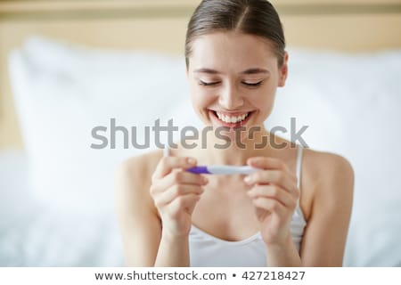 Portrait Of Young Happy Woman Holding Pregnancy Test Stock photo © Pressmaster