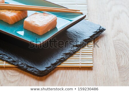Foto stock: Fresh Sushi Salmon Cream Cheese Parcels On Plate With Chopsticks