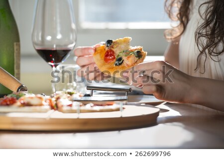 Stockfoto: Woman Eating Homemade Pizza And Drinking Red Wine