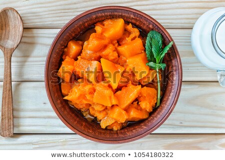 Stock fotó: Pumpkin Sliced In Clay Pot With Milk