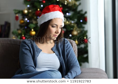 [[stock_photo]]: Disappointed Woman With Christmas Santa Claus Hat Suffering From