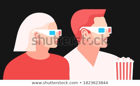 Foto d'archivio: Moviegoer At Cinema With Popcorn Stereo Glasses Watch Movie