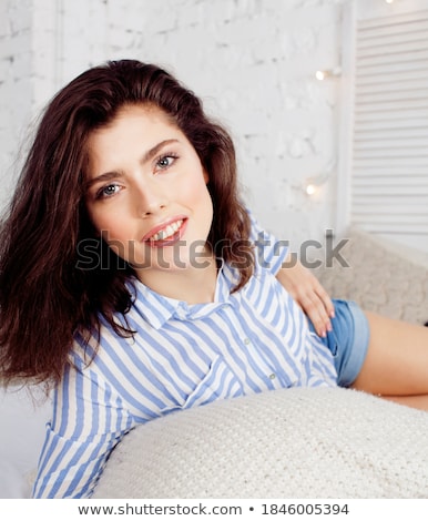 Imagine de stoc: Young Pretty Brunette Woman In Her Bedroom Sitting At Window Happy Smiling Lifestyle People Concept
