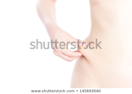 Stock fotó: Fit Woman Pinches Fat On Her Sides Isolated On White Background