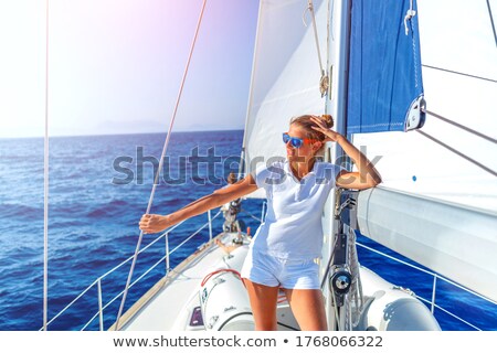 Stok fotoğraf: Teenage Girls Relaxing On Sailboat