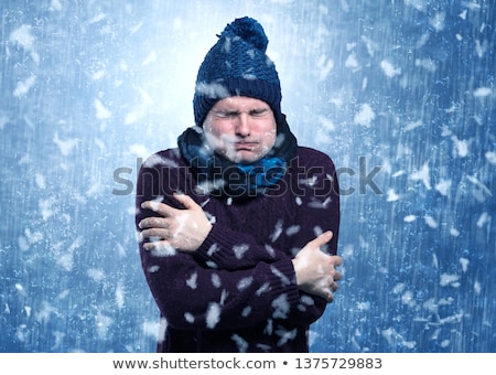 Stockfoto: Handsome Boy Shivering At Snowstorm Concept
