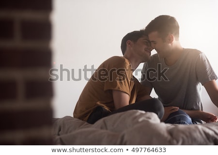 ストックフォト: A Handsome Gay Men Couple On Bed Together