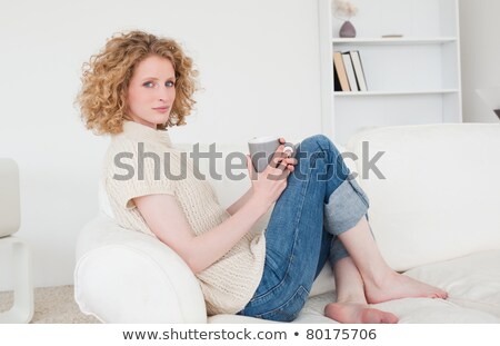 Zdjęcia stock: Beautiful Blond Woman Drinking A Coffee While Sitting On Her Bed At Home