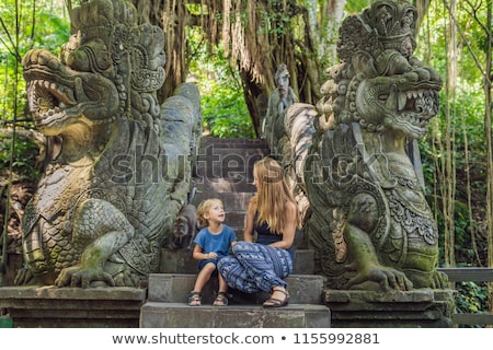 Stockfoto: Mom And Son Travelers Discovering Ubud Forest In Monkey Forest Bali Indonesia Traveling With Child