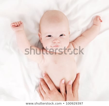 Stockfoto: Family Of Four With Baby Having Fun On Bed