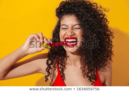 Сток-фото: Emotional Woman In Swimwear Eat Pepper Chili