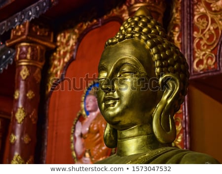 [[stock_photo]]: Golden Buddha Sculpture In Tibetan Monastery